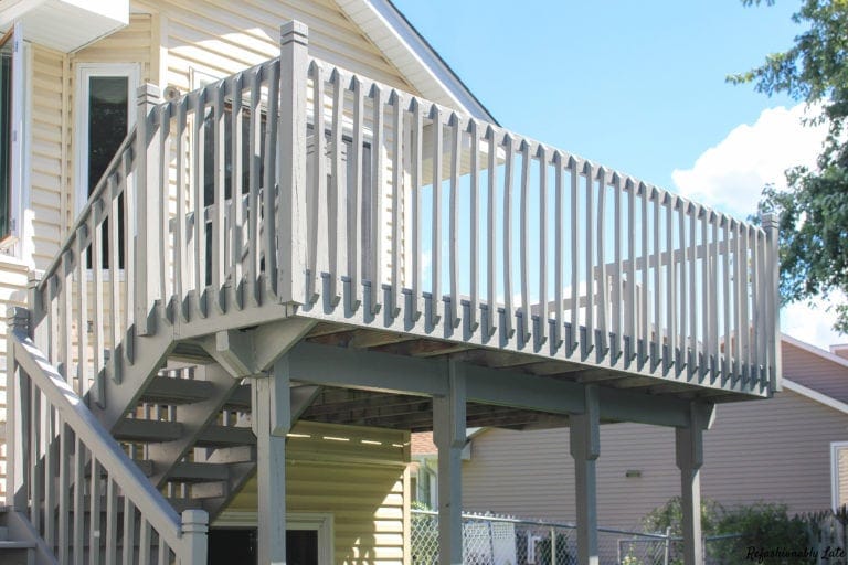 yellow house with light gray deck