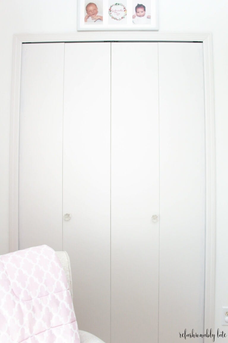 white closet against white walls and a rocking chair in front