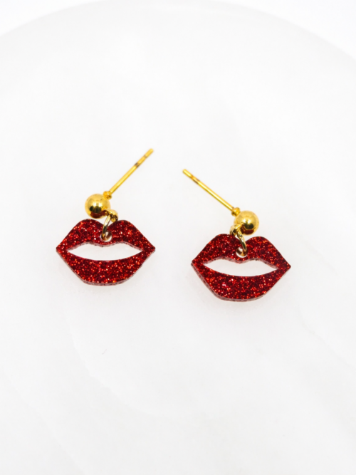Bold red glitter lip dangle earrings with a playful, flirty design—sparkly, eye-catching, and perfect for adding a fun pop of personality to any look.