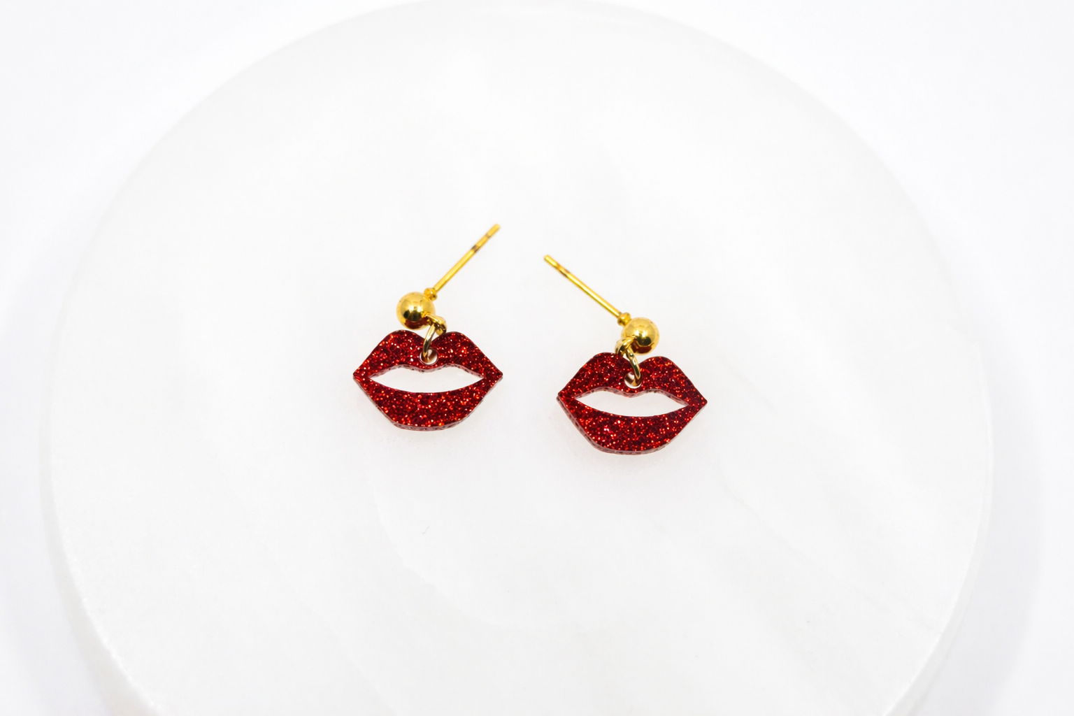 Bold red glitter lip dangle earrings with a playful, flirty design—sparkly, eye-catching, and perfect for adding a fun pop of personality to any look.