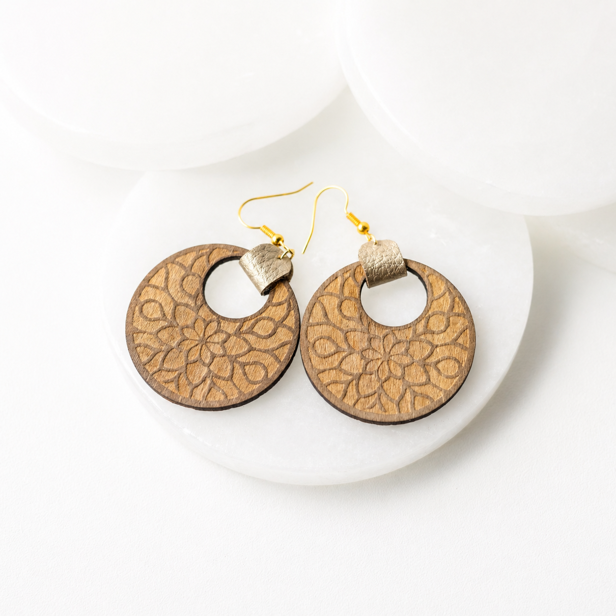Wooden mandala dangle earrings with laser engraved floral design and gold hook backs