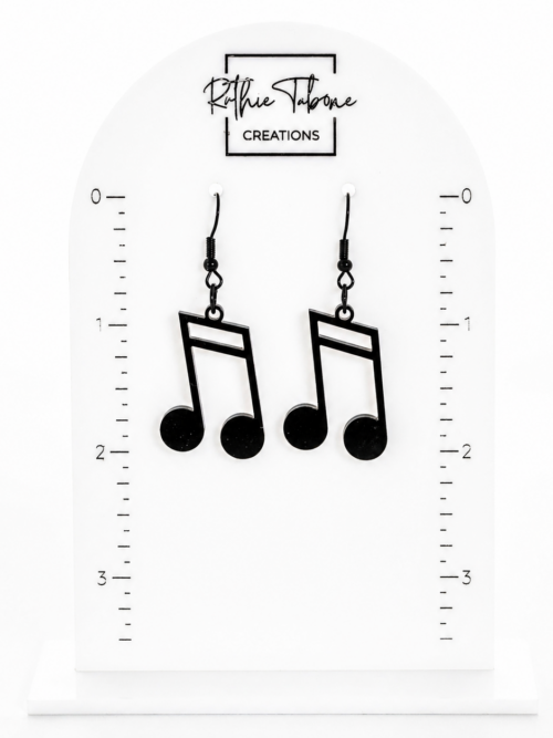 Black music note dangle earrings with hook backs shown on measurement display card