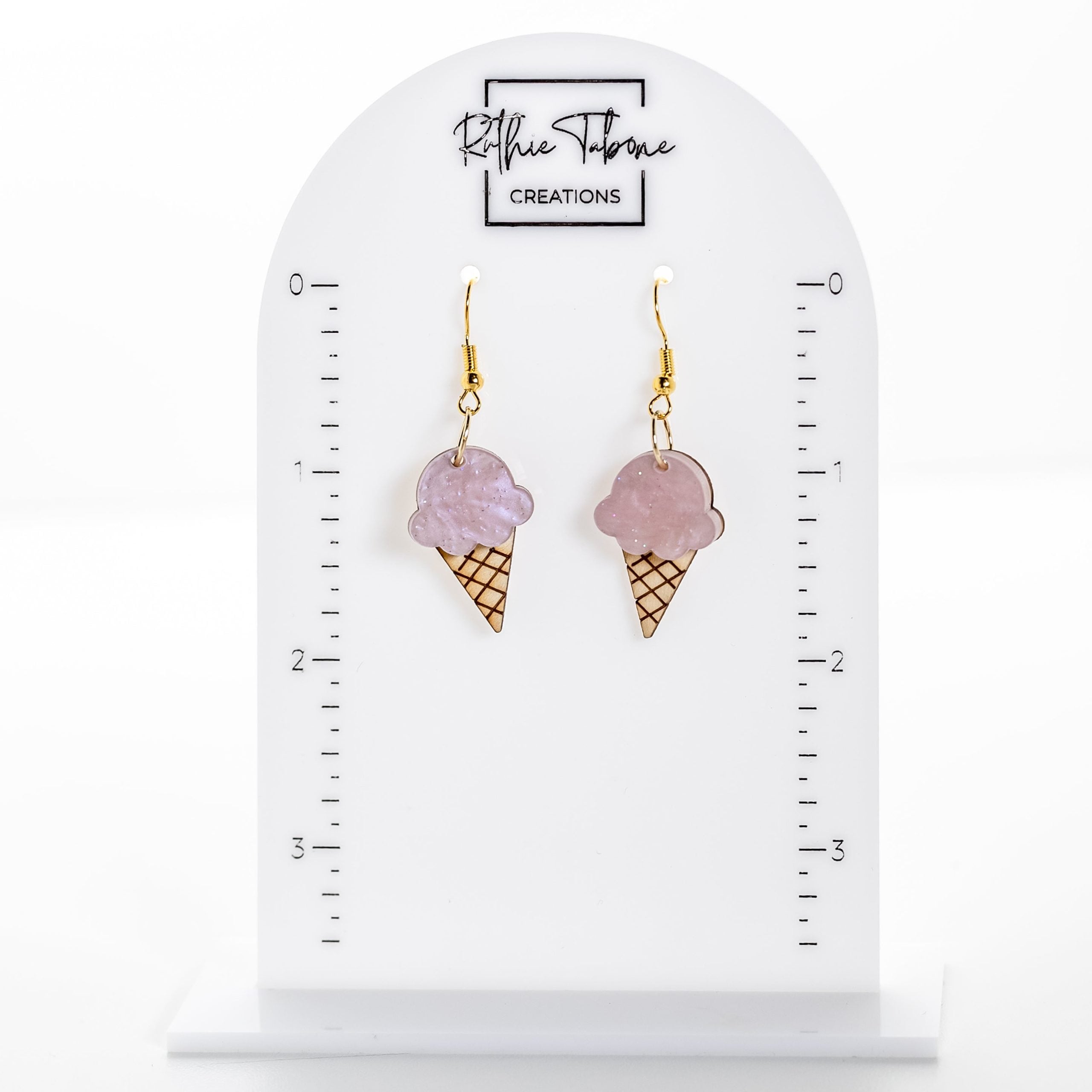 Handmade pink ice cream cone acrylic dangle earrings with gold hooks by Ruthie Tabone Creations displayed on white jewelry card.