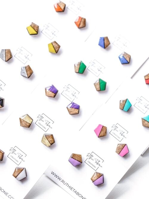 Handmade geometric wood and colorful resin stud earrings in a variety of colors, including pink, purple, turquoise, green, blue, orange, yellow, black, silver, gold, and white.