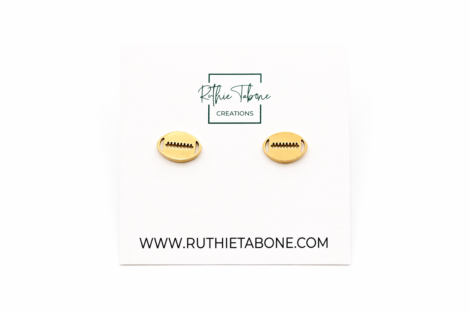 Silver football stud earrings with engraved lace detail displayed on a Ruthie Tabone Creations card against a clean white background.
