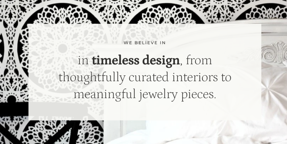 Interior design inspiration featuring a dramatic black-and-white patterned accent wall, elegant white bedroom furniture, and the quote, "We believe in timeless design, from thoughtfully curated interiors to meaningful jewelry pieces," highlighting Ruthie Tabone's approach to timeless interior design and handcrafted jewelry.