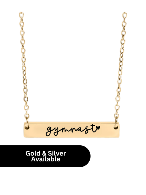 Gold bar necklace with “gymnast” and heart engraving on a delicate gold chain, shown on a white background with gold and silver options available.